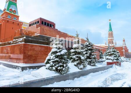 Moscow in snowy winter, Russia. Lenin`s Mausoleum by Moscow Kremlin on Red Square under snow. Mausoleum is a famous landmark of Moscow. The inscriptio Stock Photo